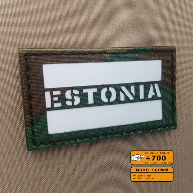 A patch of the Estonia flag with size 2"x3.5" in Woodland background with solid white