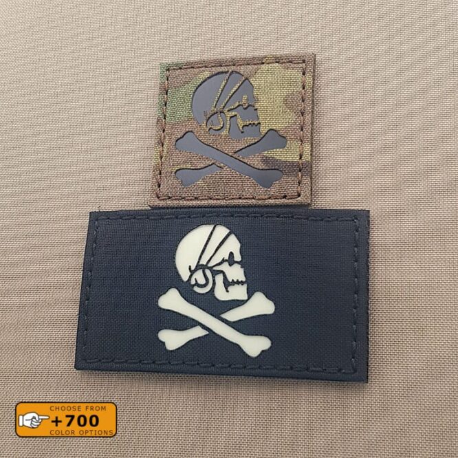Two patches of the Henry Avery Pirate flag: one with size 2"x2" with Multicam background infrared (IR) and another one with size 2"x3.5" in black with Glow in the Dark