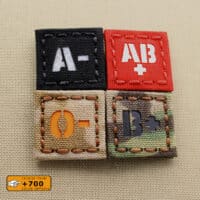 Four patches of blood type: all of them with size 1"x1" in diferent fabrics and colors/texts