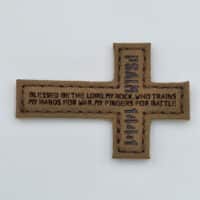 A patch of the Jesuchist cross shape wiht de PSALM 144:1 "Blessed be the lord, my rock, who trains my hands for war, and my fingers for battle."