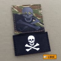 2 patches of the Jolly Roger flag with the crossbones: one with size 2"x3.5" in black background with solid white and the other one with size 3"x3" with Tiger Stripe camo IR (infrared)
