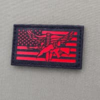 A patch of the USA Flag SWAT Eagle in 2x3.5inch with black background with solid red